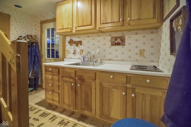 10484 N County Road 750 W, Freetown, IN 47235 - kitchen with a sink, wallpapered walls, light tile patterned floors, light countertops, and stainless steel electric cooktop