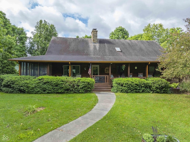 10484 N County Road 750 W, Freetown, IN 47235 - rear view of house featuring a porch, a lawn, a chimney, and roof with shingles