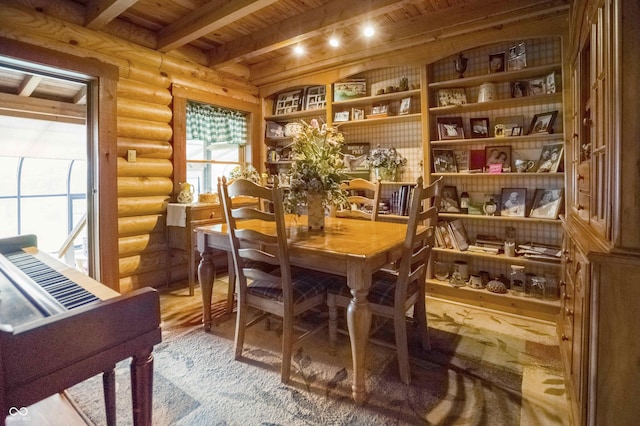 10484 N County Road 750 W, Freetown, IN 47235 - dining room featuring log walls, wooden ceiling with exposed beams, and wood finished floors