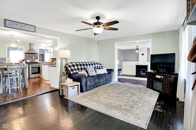 356 Daugherty St, Columbus, IN 47201 - living area with plenty of natural light, a ceiling fan, dark wood-type flooring, and a chandelier
