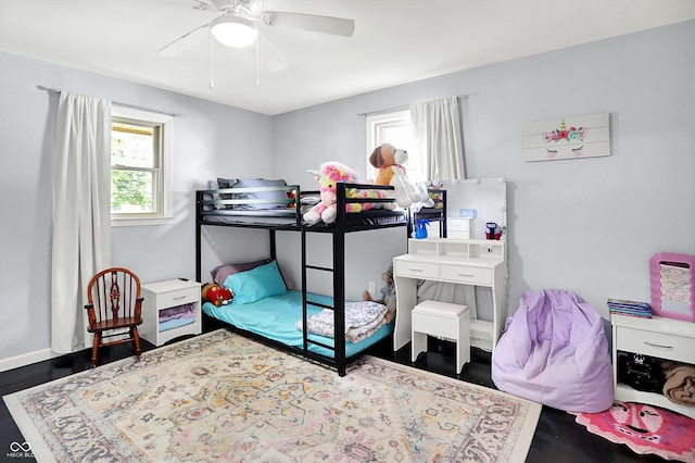 356 Daugherty St, Columbus, IN 47201 - bedroom with multiple windows, wood finished floors, and a ceiling fan