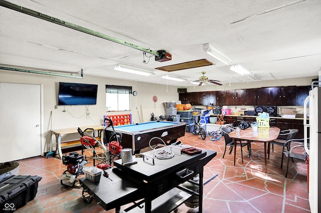 356 Daugherty St, Columbus, IN 47201 - garage featuring a garage door opener and freestanding refrigerator