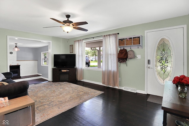 356 Daugherty St, Columbus, IN 47201 - living area featuring baseboards, a ceiling fan, and dark wood-style floors