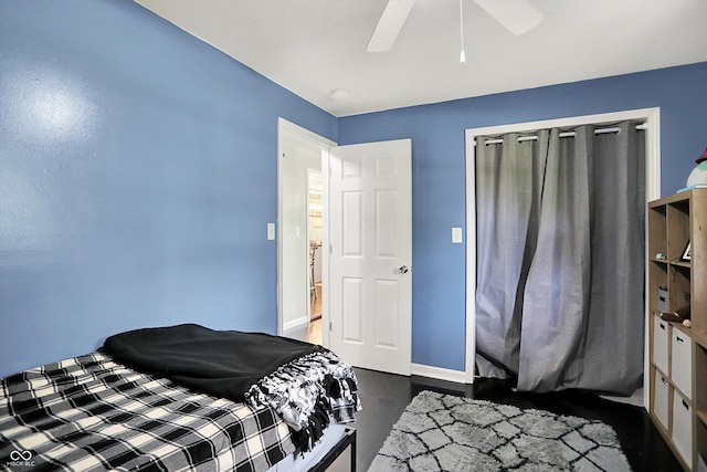 356 Daugherty St, Columbus, IN 47201 - bedroom with baseboards, dark wood-style flooring, and a ceiling fan