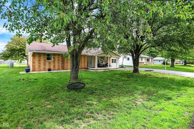 356 Daugherty St, Columbus, IN 47201 - ranch-style home featuring brick siding, a porch, and driveway