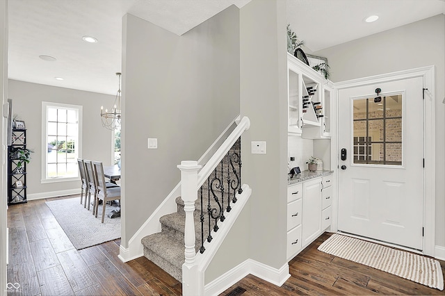 3398 Nottinghill Blvd, Plainfield, IN 46168 - foyer featuring dark wood-type flooring, a chandelier, stairway, recessed lighting, and baseboards