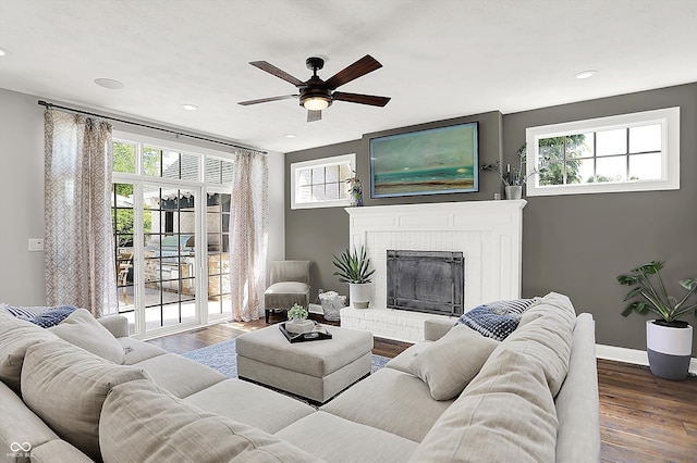 3398 Nottinghill Blvd, Plainfield, IN 46168 - living room featuring wood finished floors, ceiling fan, healthy amount of natural light, and recessed lighting