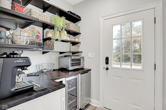 3398 Nottinghill Blvd, Plainfield, IN 46168 - bar with plenty of natural light, wine cooler, baseboards, and fridge