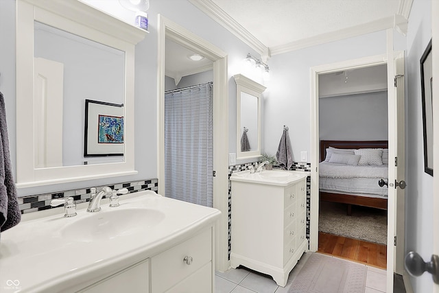 3398 Nottinghill Blvd, Plainfield, IN 46168 - ensuite bathroom featuring crown molding, tile patterned floors, two vanities, and decorative backsplash