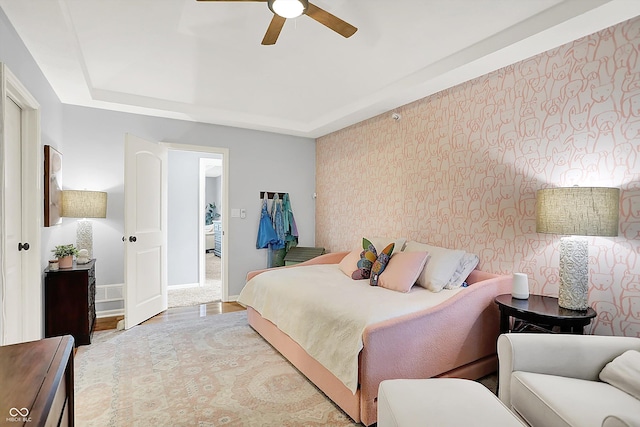 3398 Nottinghill Blvd, Plainfield, IN 46168 - bedroom featuring a raised ceiling, baseboards, wood finished floors, and a ceiling fan