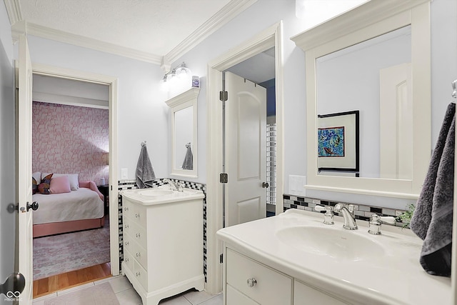 3398 Nottinghill Blvd, Plainfield, IN 46168 - ensuite bathroom with two vanities, crown molding, and tile patterned floors