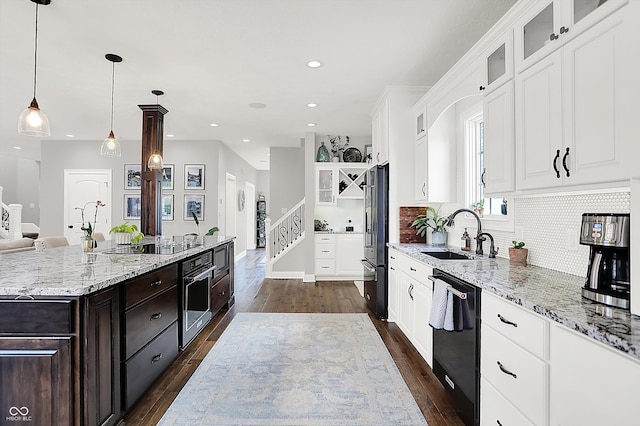 3398 Nottinghill Blvd, Plainfield, IN 46168 - kitchen with black appliances, a sink, white cabinets, dark brown cabinets, and recessed lighting
