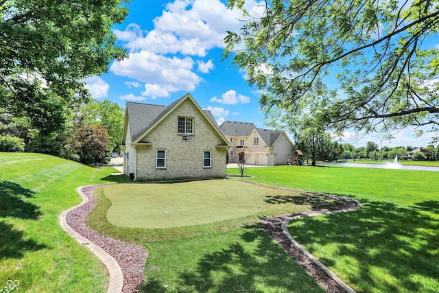 3398 Nottinghill Blvd, Plainfield, IN 46168 - rear view of house with a lawn, a putting area, and brick siding