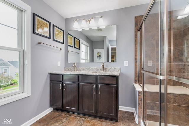 2436 Gwinnett St, Carmel, IN 46032 - full bath featuring baseboards, double vanity, and a stall shower