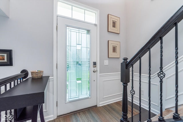 2436 Gwinnett St, Carmel, IN 46032 - entrance foyer with stairway, a decorative wall, and wainscoting