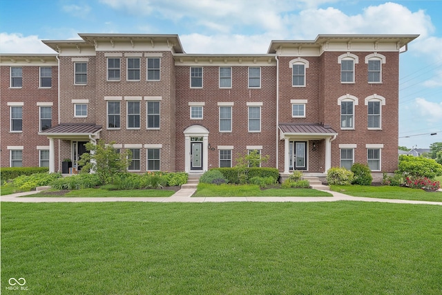 2436 Gwinnett St, Carmel, IN 46032 - italianate-style house with brick siding and a front yard