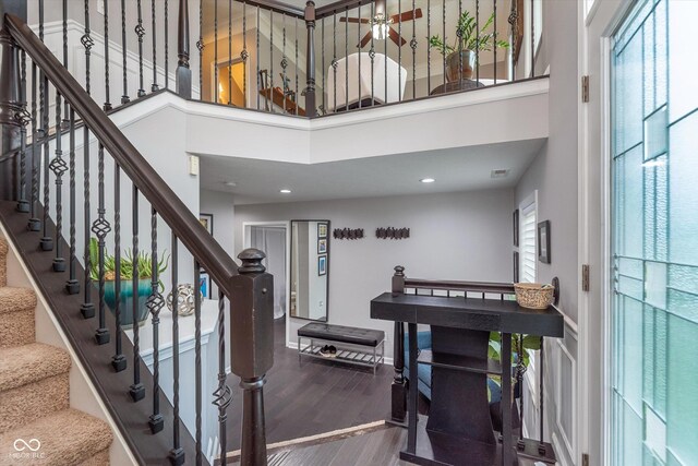 2436 Gwinnett St, Carmel, IN 46032 - foyer entrance with a towering ceiling, wood finished floors, recessed lighting, stairway, and baseboards