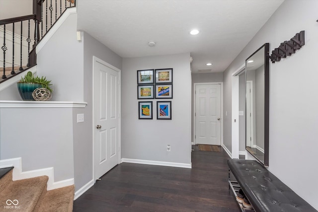 2436 Gwinnett St, Carmel, IN 46032 - hall with stairs, wood finished floors, baseboards, and recessed lighting