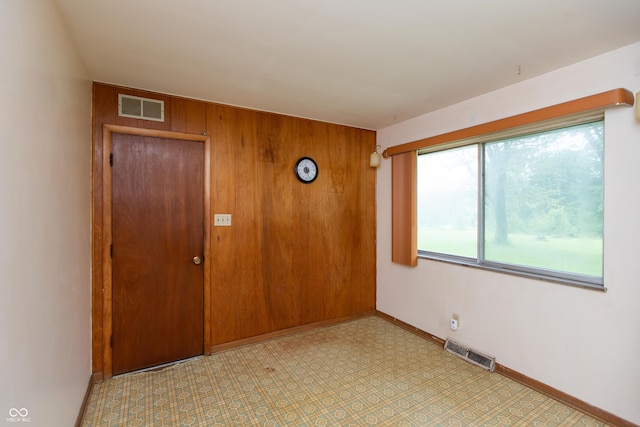 6498 N County Road 475 E, Pittsboro, IN 46167 - empty room featuring baseboards and wood walls