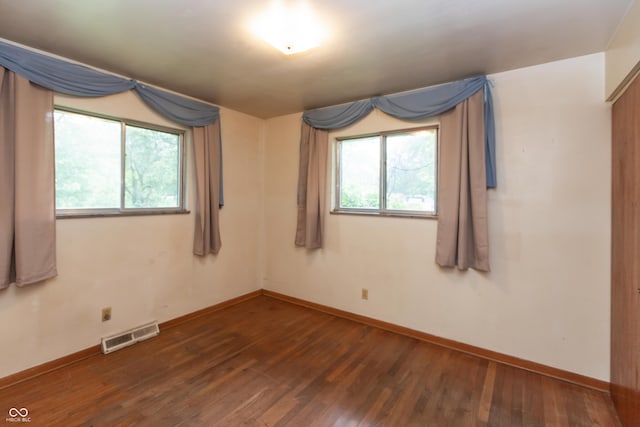 6498 N County Road 475 E, Pittsboro, IN 46167 - unfurnished room featuring wood-type flooring, healthy amount of natural light, and baseboards