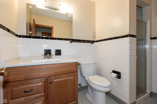 6498 N County Road 475 E, Pittsboro, IN 46167 - full bath with tile walls, toilet, vanity, a stall shower, and wainscoting
