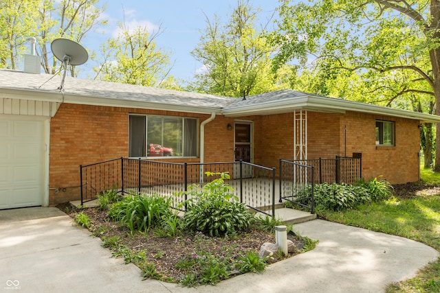 6498 N County Road 475 E, Pittsboro, IN 46167 - ranch-style home with brick siding, a shingled roof, covered porch, a garage, and a chimney