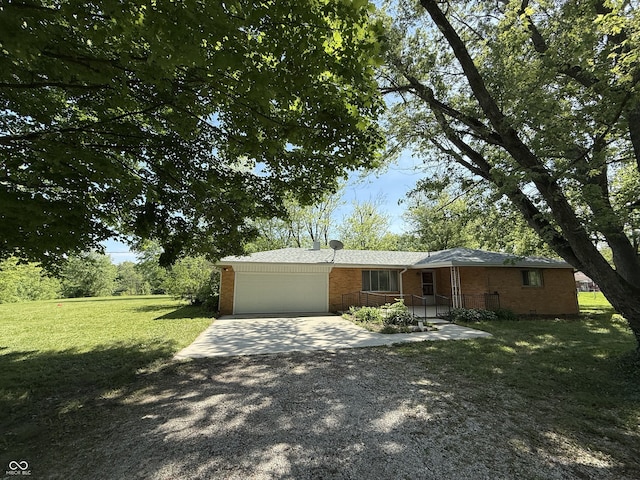 6498 N County Road 475 E, Pittsboro, IN 46167 - view of front of property with a garage, driveway, brick siding, and a front lawn
