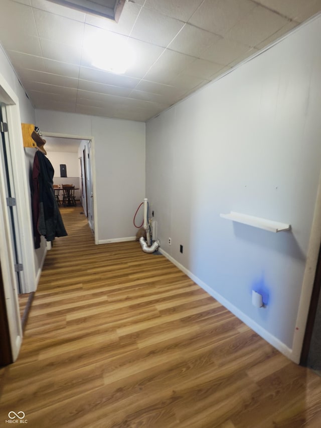 3385 W Commerce St, Vallonia, IN 47281 - laundry area featuring wood finished floors and baseboards