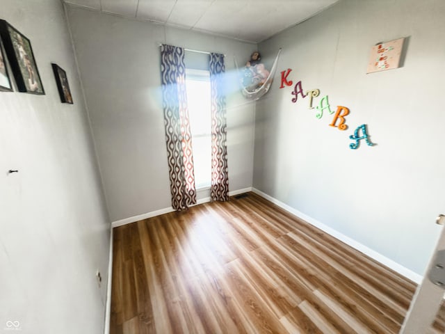 3385 W Commerce St, Vallonia, IN 47281 - empty room featuring wood finished floors and baseboards