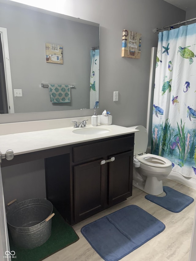 8241 Morera Ct, Indianapolis, IN 46237 - full bathroom featuring vanity, wood finished floors, and a shower with shower curtain