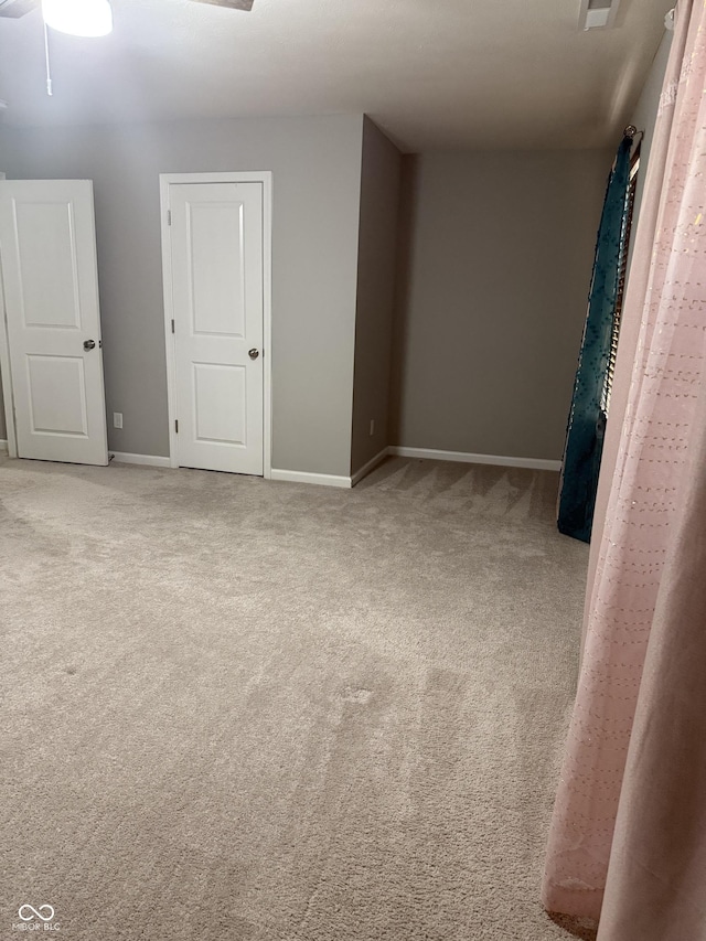 8241 Morera Ct, Indianapolis, IN 46237 - carpeted spare room featuring baseboards and a ceiling fan