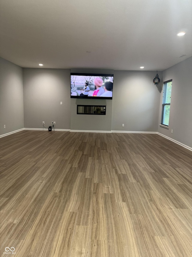 8241 Morera Ct, Indianapolis, IN 46237 - unfurnished living room featuring wood finished floors and recessed lighting
