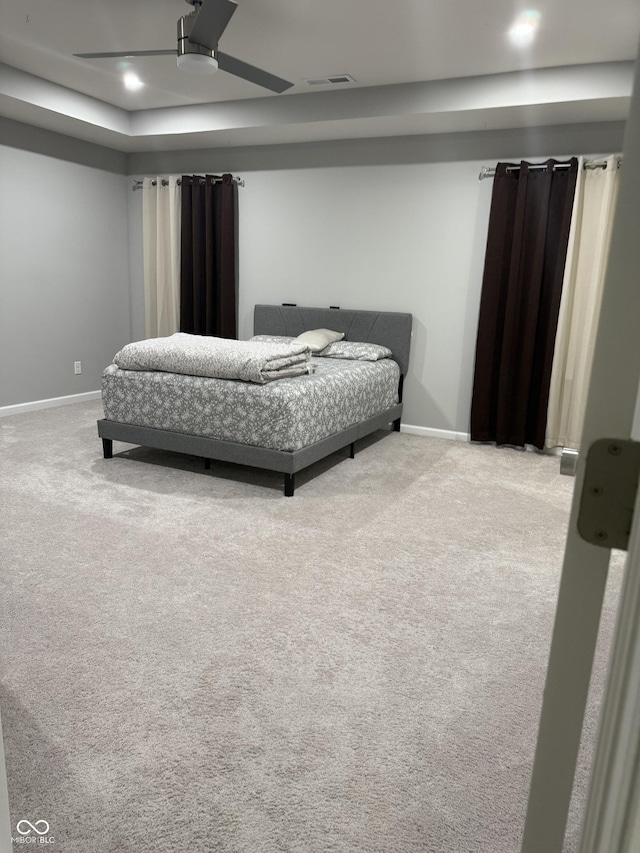 8241 Morera Ct, Indianapolis, IN 46237 - carpeted bedroom with a ceiling fan and a tray ceiling