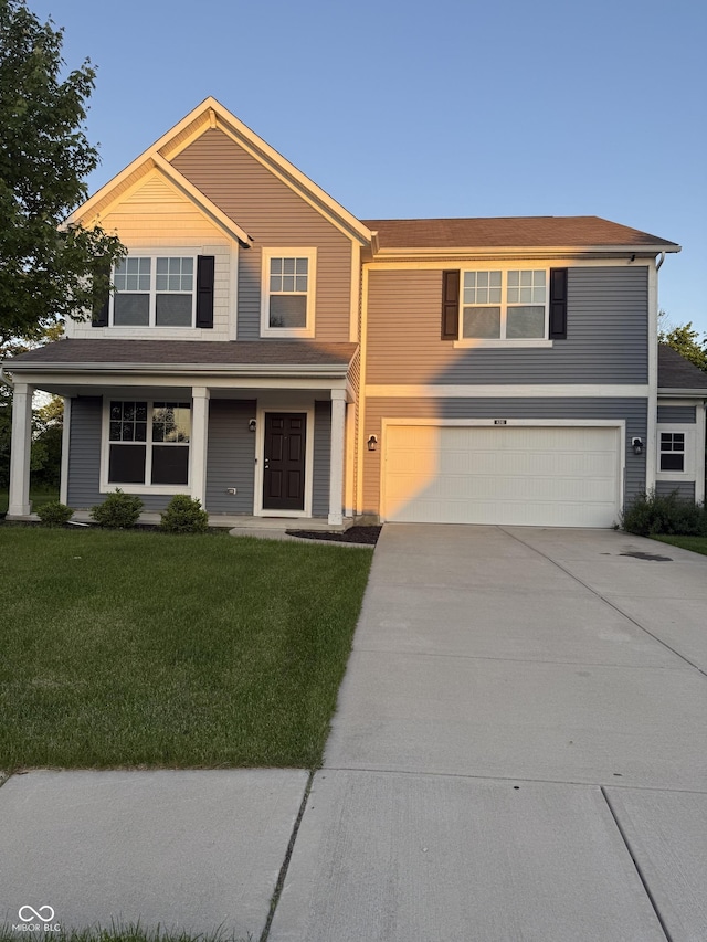 8241 Morera Ct, Indianapolis, IN 46237 - view of front of home featuring a garage, concrete driveway, and a front lawn