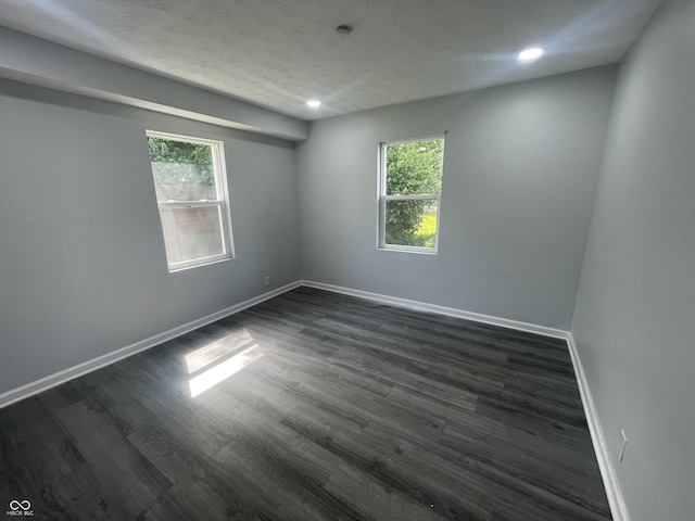 2911 E 35th St, Indianapolis, IN 46218 - spare room featuring plenty of natural light, baseboards, dark wood finished floors, and recessed lighting
