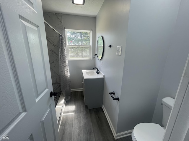 2911 E 35th St, Indianapolis, IN 46218 - bathroom with toilet, wood finished floors, a shower with shower curtain, and vanity