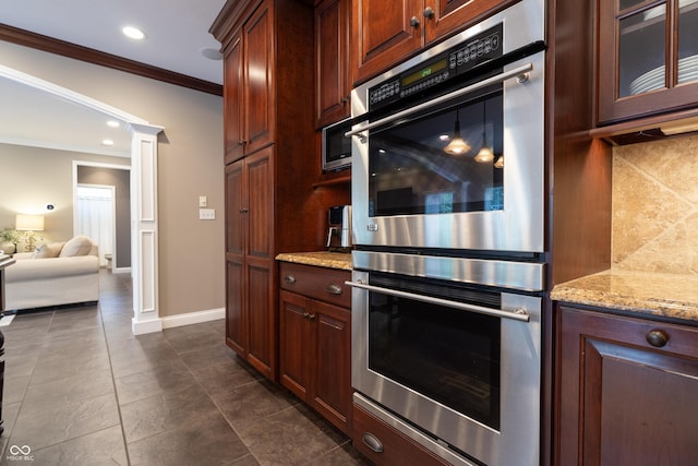 876 Box Turtle Ct, Columbus, IN 47201 - kitchen with double oven, crown molding, tasteful backsplash, glass insert cabinets, and light stone counters