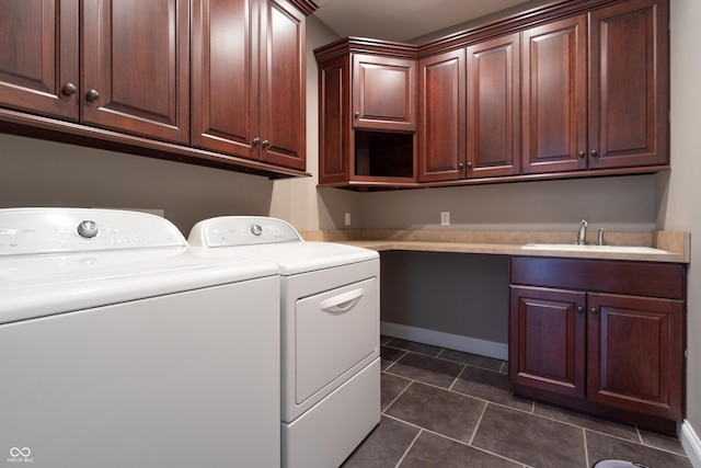 876 Box Turtle Ct, Columbus, IN 47201 - laundry area featuring washing machine and clothes dryer, cabinet space, and dark tile patterned floors