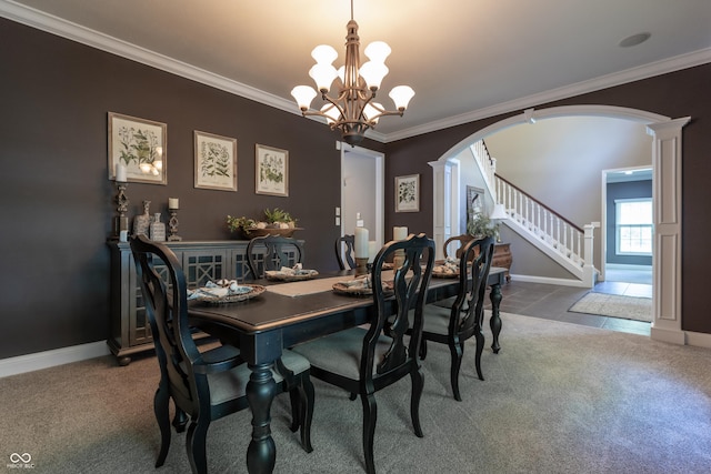 876 Box Turtle Ct, Columbus, IN 47201 - carpeted dining space with arched walkways, a chandelier, ornate columns, crown molding, and stairway