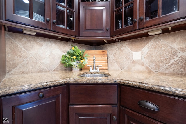 876 Box Turtle Ct, Columbus, IN 47201 - kitchen featuring a sink, dark brown cabinets, and glass insert cabinets