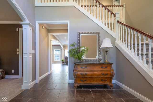 876 Box Turtle Ct, Columbus, IN 47201 - stairway featuring arched walkways, ornamental molding, baseboards, and decorative columns