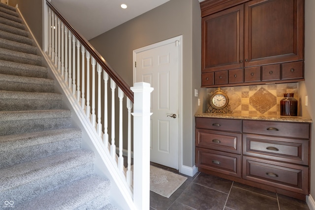 876 Box Turtle Ct, Columbus, IN 47201 - stairs with recessed lighting, tile patterned floors, and baseboards