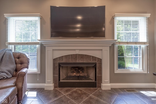 876 Box Turtle Ct, Columbus, IN 47201 - detailed view of baseboards and a tiled fireplace