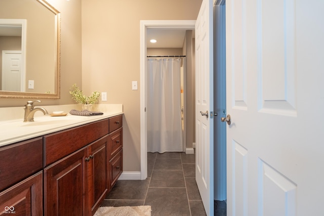 876 Box Turtle Ct, Columbus, IN 47201 - full bath featuring vanity, tile patterned floors, a shower with shower curtain, and baseboards