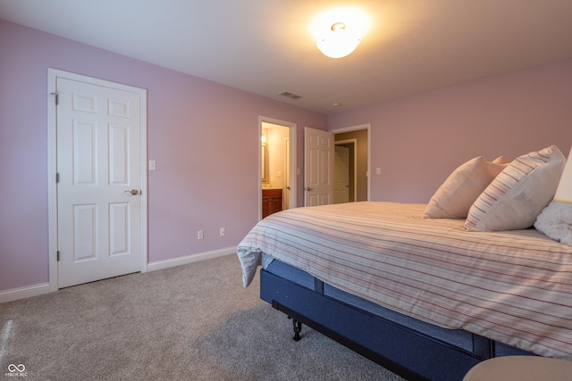 876 Box Turtle Ct, Columbus, IN 47201 - carpeted bedroom with baseboards and connected bathroom