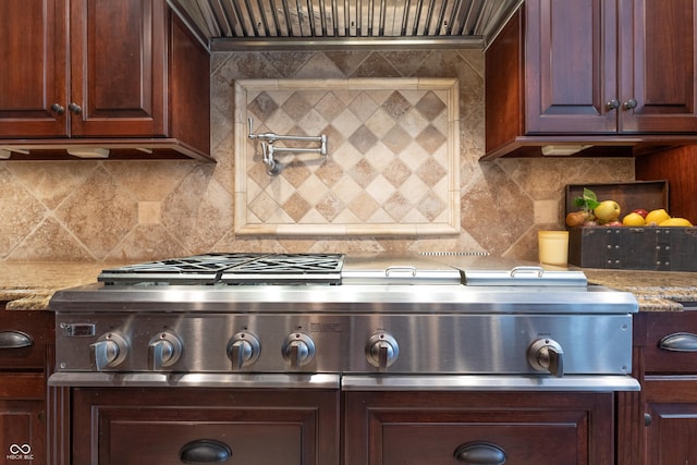 876 Box Turtle Ct, Columbus, IN 47201 - kitchen featuring tasteful backsplash, stainless steel gas cooktop, and light stone counters