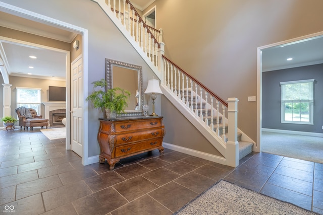 876 Box Turtle Ct, Columbus, IN 47201 - stairs with ornamental molding, baseboards, recessed lighting, and a tiled fireplace