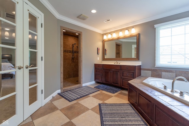 876 Box Turtle Ct, Columbus, IN 47201 - ensuite bathroom with french doors, vanity, a garden tub, tiled shower, and crown molding