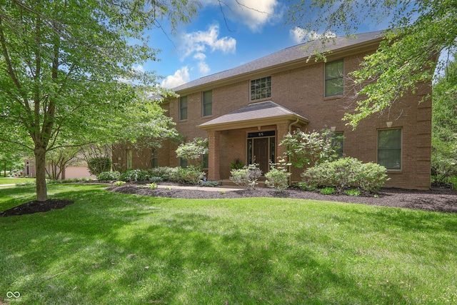 876 Box Turtle Ct, Columbus, IN 47201 - view of front of home with a front yard and brick siding