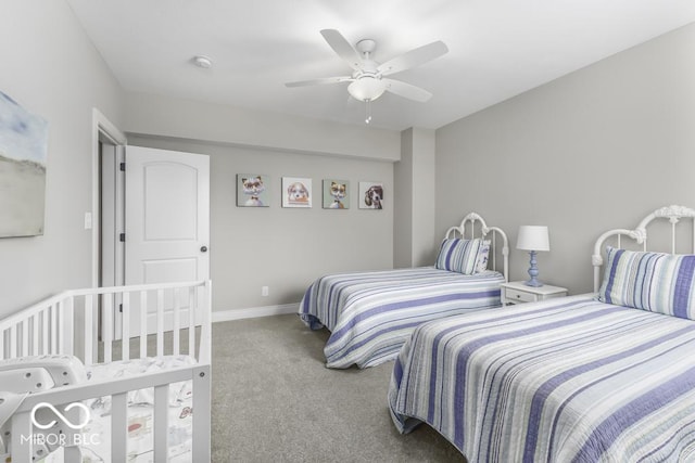 7648 Killarney Dr, Indianapolis, IN 46217 - carpeted bedroom with baseboards and a ceiling fan